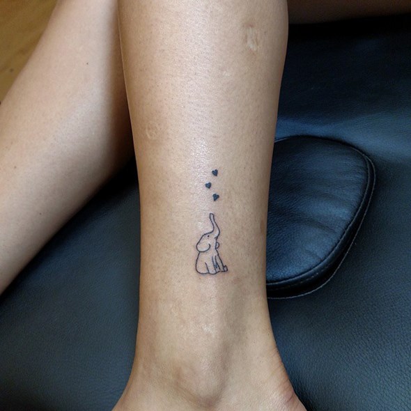small-baby-elephant-tattoo-trunk-up