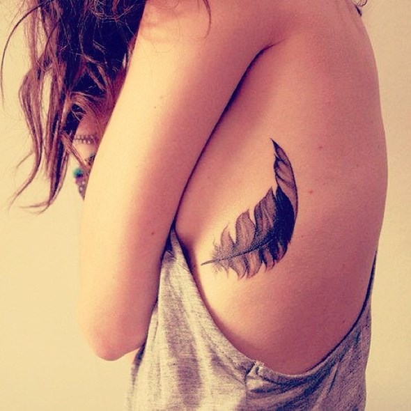 small-feather-rib-tattoo