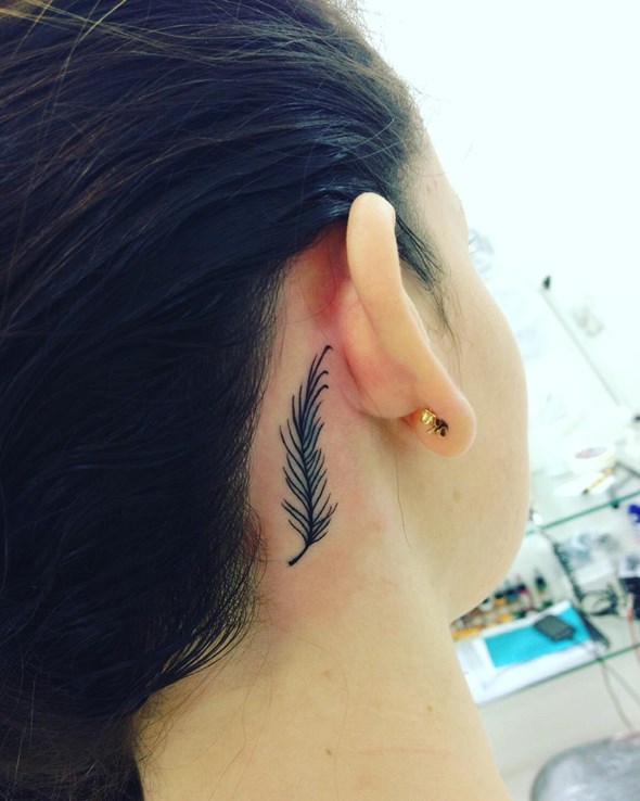 small-feather-tattoo-behind-ear