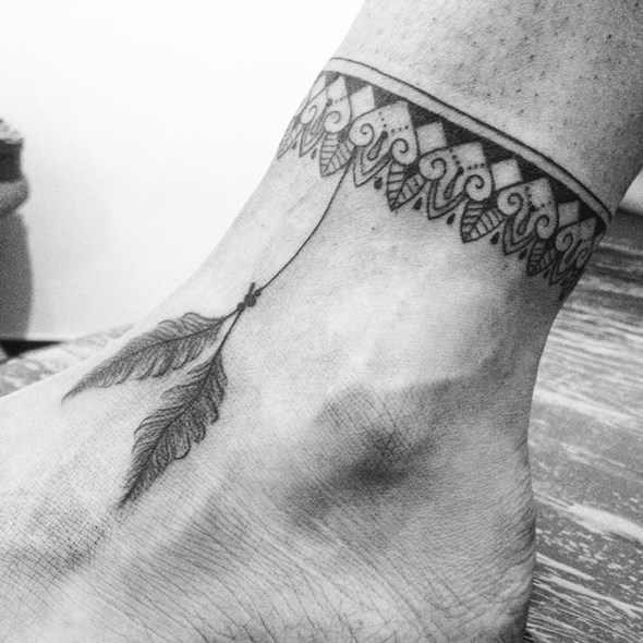 small-native-feather-tattoo-on-foot