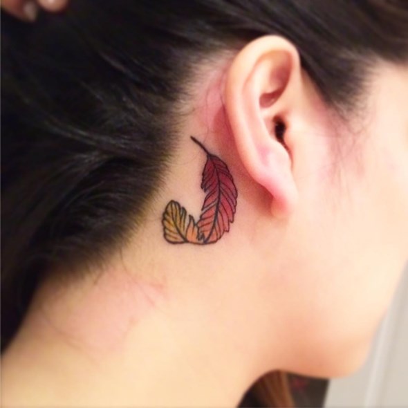 small-phoenix-feather-tattoo-behind-the-ear