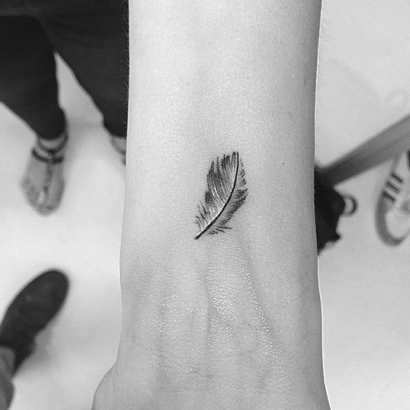tiny-feather-tattoo-on-wrist