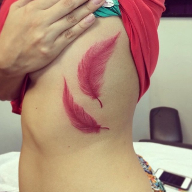 red-feathers-tattoo-ideas-on-ribs