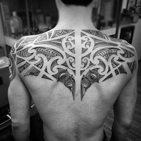 upper-back-negative-space-maori-male-tattoos
