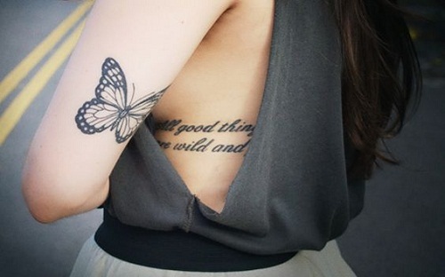 small-butterfly-on-upper-back-arm-tattoo